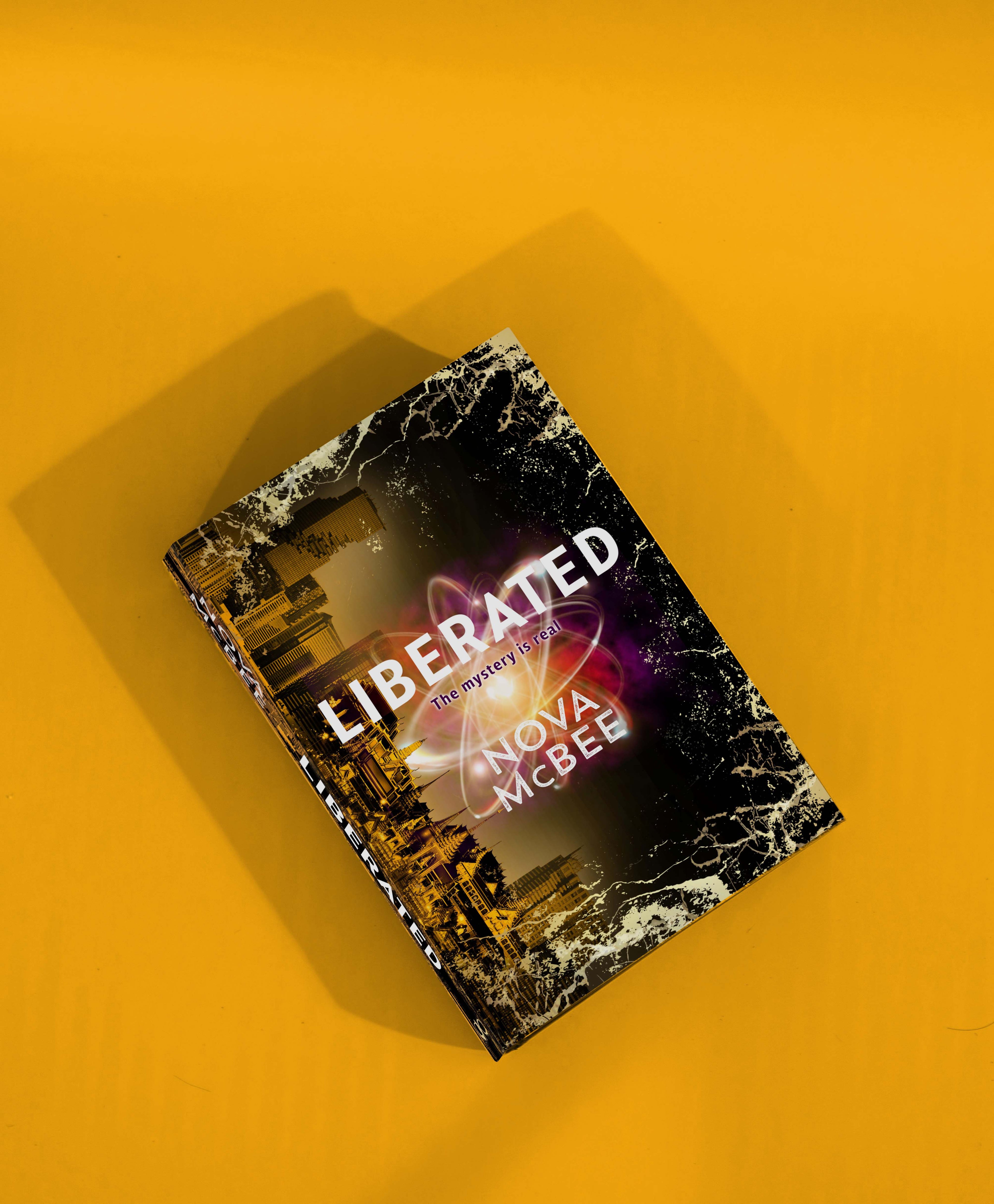 Book titled 'Liberated' by Nova McBee on a yellow background